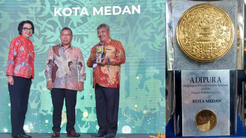 Kadis Lingkungan Hidup Medan, Muhammad Husni saat menerima penghargaan Adipura.